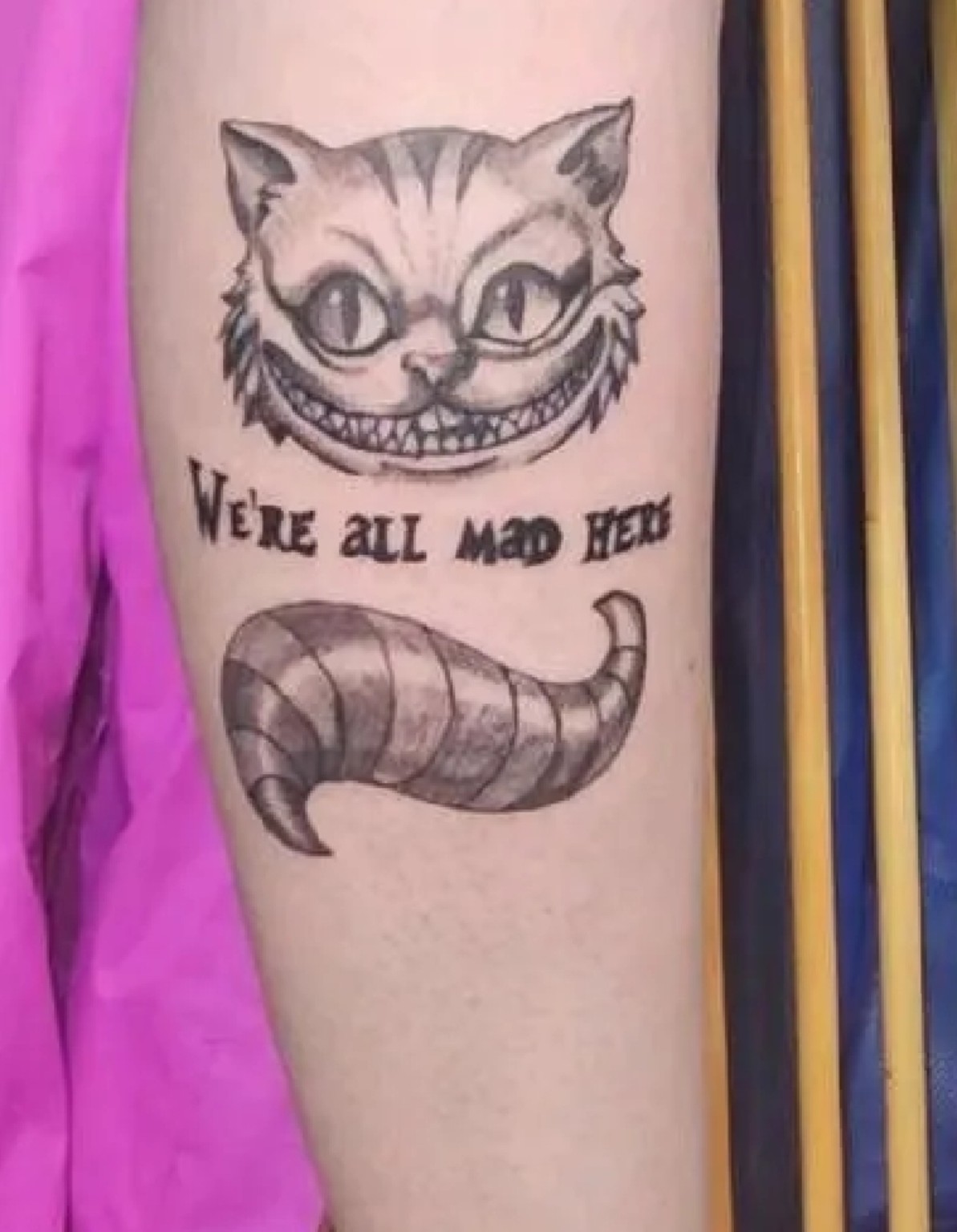 Cheshire Cat black-and-grey tattoo